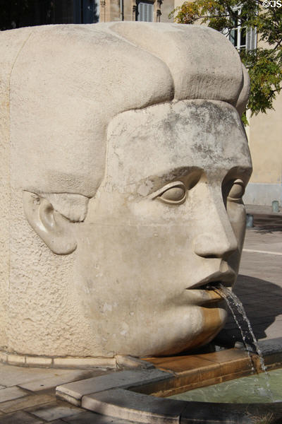 Head of god Nemausus on Nemausa fountain sculpture (1989) by Martial Raysse at Place d' Assas. Nimes, France.