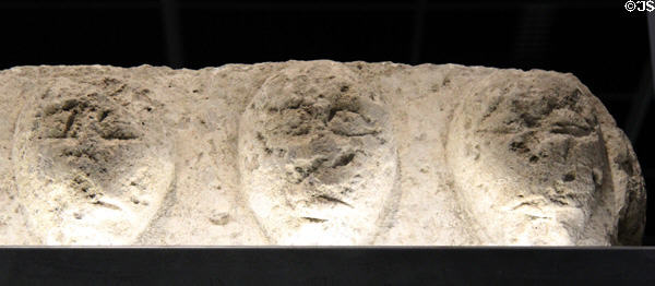 Stone carving representing cut-off heads of vanquished enemies (Iron Age) from Provence, France at Musée de la Romanité. Nimes, France.