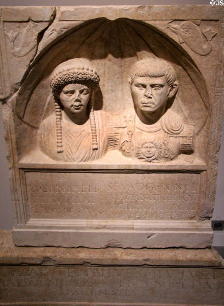 Roman marble stele with figures & epitaph of Licinia Flavilla & Sextus Adgennius Macrinus (end 1st - early 2nd C) from Nimes house beside amphitheater at Musée de la Romanité. Nimes, France.