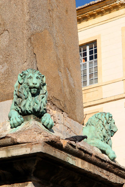 Bronze lion sculptures (19thC) by Antoine Laurent Dantan on Arles Obelisk pedestal. Arles, France.