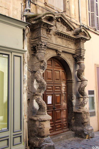 Sprial stone columns flank entrance door. Arles, France.