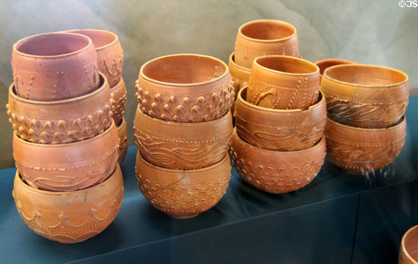 Roman-era ceramic bowls with molded decorative designs (40-100 CE) found together in Rhone River at Arles Antiquities Museum. Arles, France.