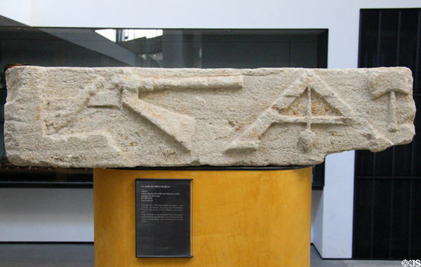 Marble tomb door lintel with carvings of tools of stone cutter (2ndC-3rdC) at Arles Antiquities Museum. Arles, France.