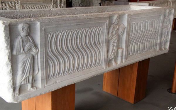 Carved Christ & Apostles on s-shaped strigil pattern on marble sarcophagus (end 4thC) at Arles Antiquities Museum. Arles, France.