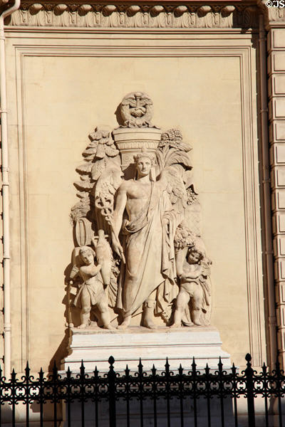 Sculpted symbols of medicine on facade of Palais de la Bourse. Marseille, France.
