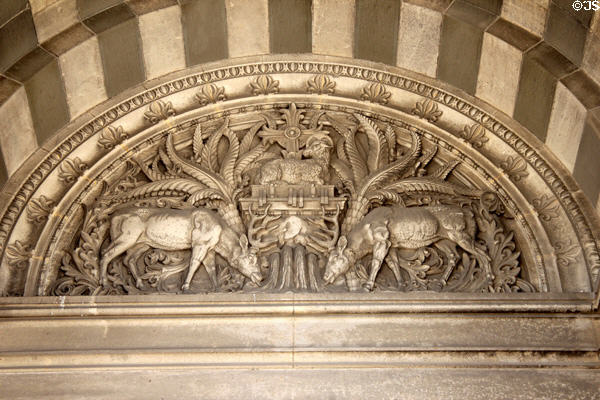 Relief of stags protecting lamb of god over entrance of Marseille Cathedral. Marseille, France.