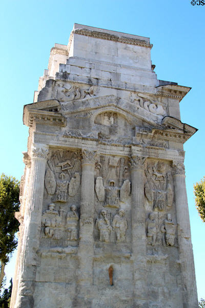 Narrow side with reliefs of arms of several Roman legions on triumphal arch of Orange. Orange, France.
