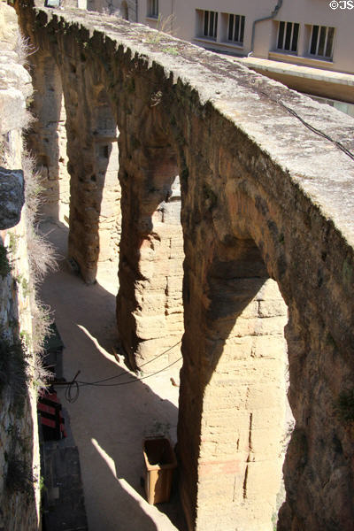 Arches ringing outer limits of seating area of Roman Theatre of Orange. Orange, France.