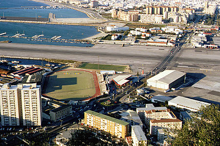 The runway in Gibraltar which is built out into Algeciras Bay & crossed by the road to Spanish frontier. Gibraltar.