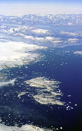 View of Greenland's icebergs as they calve from a glacier. Greenland.