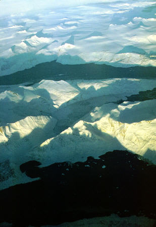 Icy mountains of Greenland seen from air. Greenland.