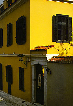 Yellow stuccoed house in Plaka in Athens. Greece.