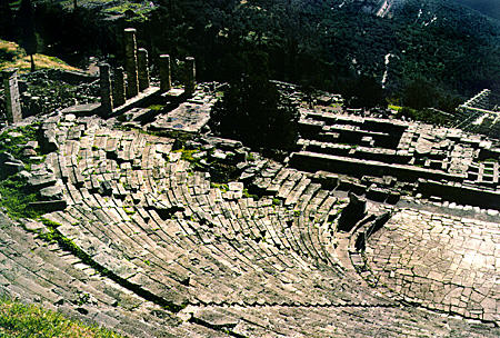 Delphi (Delfi) Theatre with Temple of Apollo in the background. Greece.