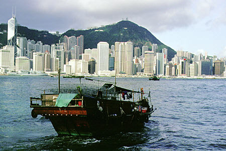 Junk sails between Hong Kong & Kowloon. Hong Kong.