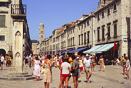 Crowds walk along Stradun, main street of old Dubrovnik. Croatia.