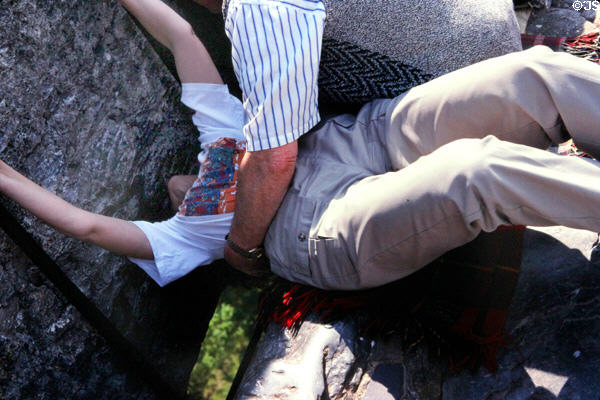 Kissing Blarney Stone at Blarney Castle is not for those afraid of heights. Ireland.