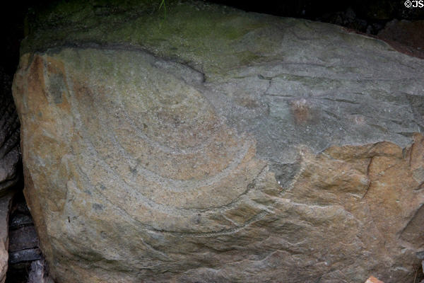 Neolithic carved stone with spiral at Knowth. Ireland.