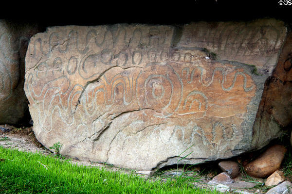 Neolithic carved stone with river-like design at Knowth. Ireland.