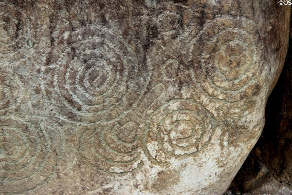 Neolithic carved stone with labyrinth-like design at Knowth. Ireland.
