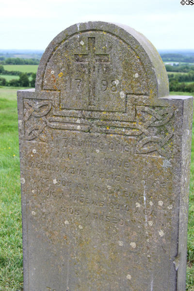 Christian monument slab (1798) with Celtic decoration & language at Hill of Tara. Ireland.