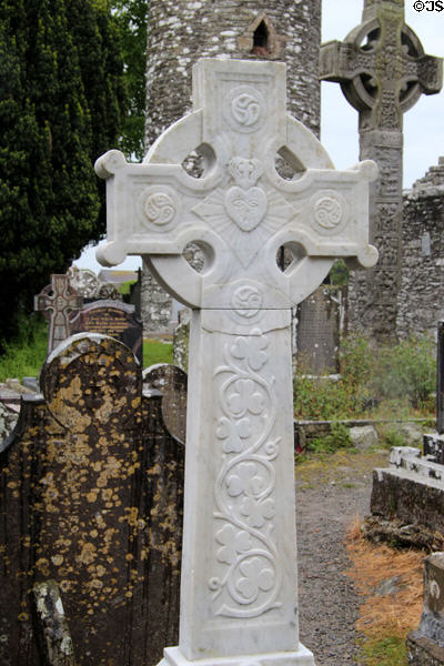 Modern Celtic cross with shamrocks at Monasterboice. Ireland.