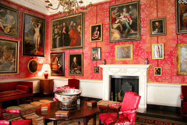 Red Drawing Room with collection of old masters oil paintings at Castletown House. Ireland.