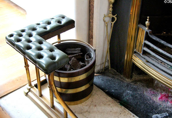 Fireplace seat with coal bucket at Little Museum of Dublin. Dublin, Ireland.
