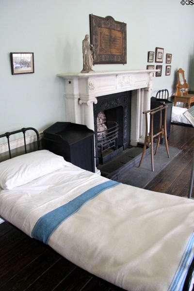 Student dormitory with fireplace & clothes drying rack at Pearse Museum. Dublin, Ireland.