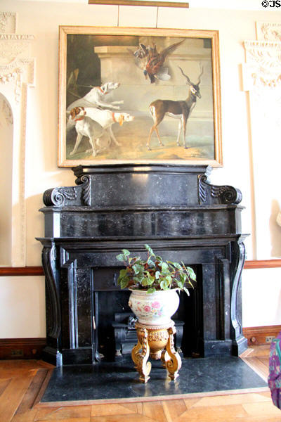 Black Kilkenny marble fireplace below Blackbuck painting in entrance hall by Richard Castle at Russborough House. Ireland.