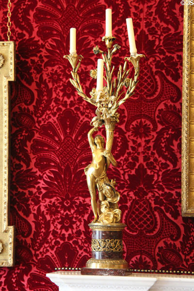 Candelabra in form of figure holding cornucopia in tapestry room at Russborough House. Ireland.