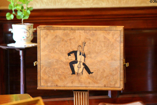 Art deco music stand with inlaid cellist by Robert Lutyens in music room at Russborough House. Ireland.