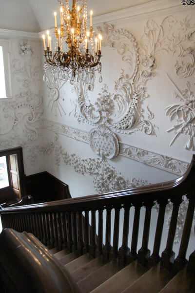 Sculpted stairwell walls & chandelier at Russborough House. Ireland.