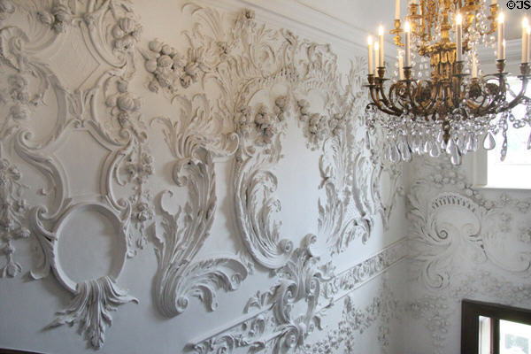 Details of sculpted stairwell walls & chandelier at Russborough House. Ireland.