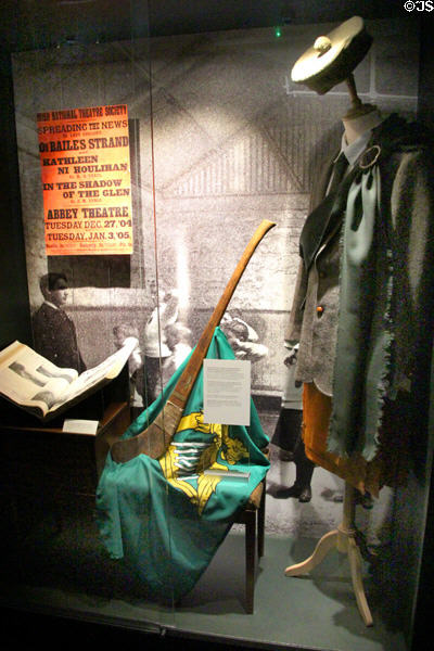 Objects from early 1900s reflecting increasing interest in Irish Celtic culture, including green flag with harp of Irish nationalists & kilts at GPO Museum. Dublin, Ireland.