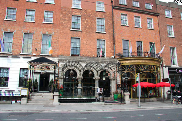 Variety of entrance overhangs (33-37 Dawson St.). Dublin, Ireland.