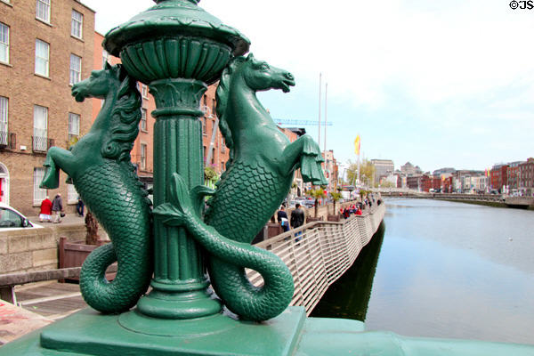 Double sea horse light standards on Grattan Bridge over River Liffey. Dublin, Ireland.