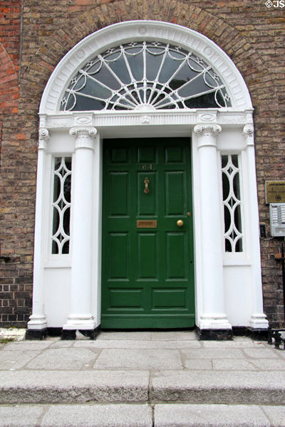 Black Georgian door of Mathematician John Lighton Synge house on Merrion Square. Dublin, Ireland.