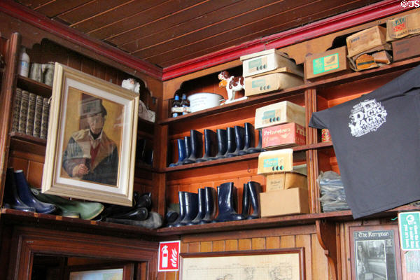 Boots & shoe boxes on shelves at Dick Mack's Pub in Dingle. Dingle, Ireland.
