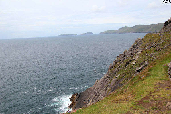 Steep cliff dropping into sea along loop road on Dingle Peninsula. Ireland.