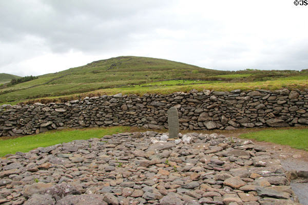 Ancient stone with cross at Gallarus Oratory on Dingle Peninsula. Ireland.