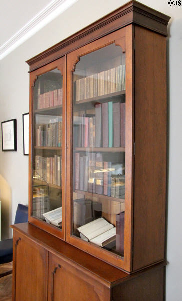 Glass fronted bookcase in study at Derrynane House. Ireland.