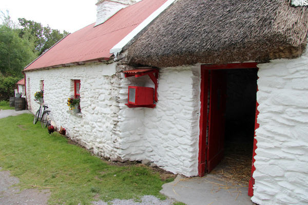 Kissane's, a small sized farm with corrugated iron roof & underthatching at Muckross Traditional Farms in Killarney National Park. Killarney, Ireland.