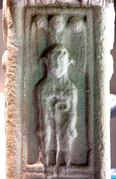 David as shepherd protected by angel detail on Cross of Scriptures (south edge) at Clonmacnoise museum. Ireland.