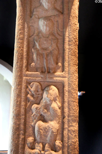 Carved panels of St Paul & St Anthony above burial of St Paul the hermit on north edge of Cross of Scriptures at Clonmacnoise museum. Ireland.
