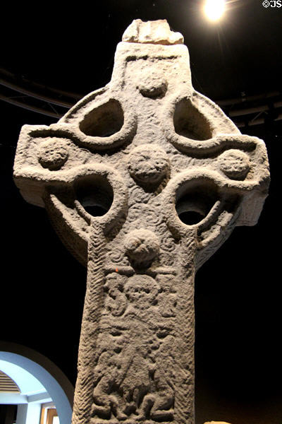 Detail of with crucifixion & five bosses on South Cross at Clonmacnoise museum. Ireland.