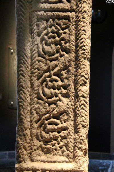 Rich interlacing detail on South Cross at Clonmacnoise museum. Ireland.