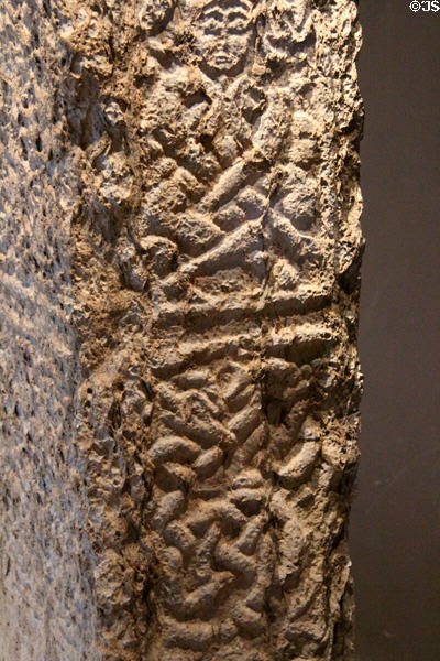 Human figure detail on North Cross at Clonmacnoise museum. Ireland.