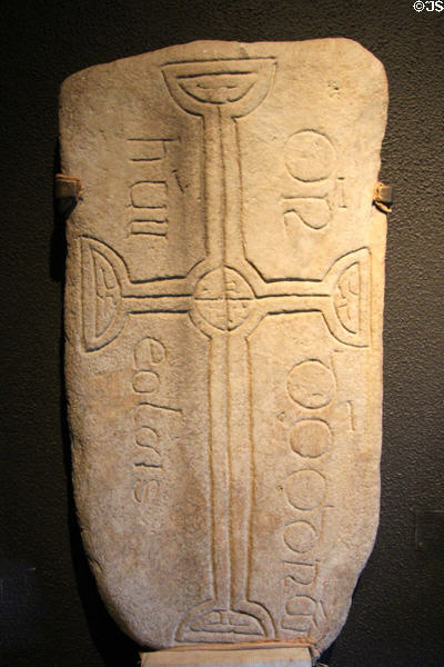 Grave slab reading "prayer for Odran who had knowledge" in Irish (994) at Clonmacnoise museum. Ireland.