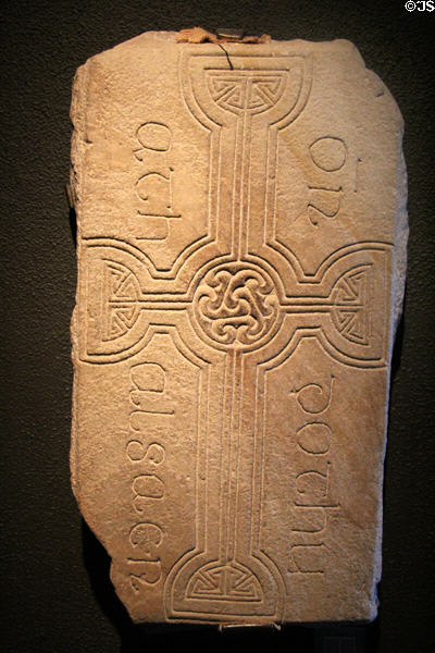 Grave slab reading "prayer for Tuathal the craftsman" in Irish at Clonmacnoise museum. Ireland.