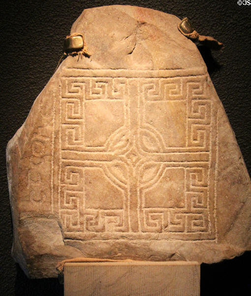 Grave slab with square cross at Clonmacnoise museum. Ireland.